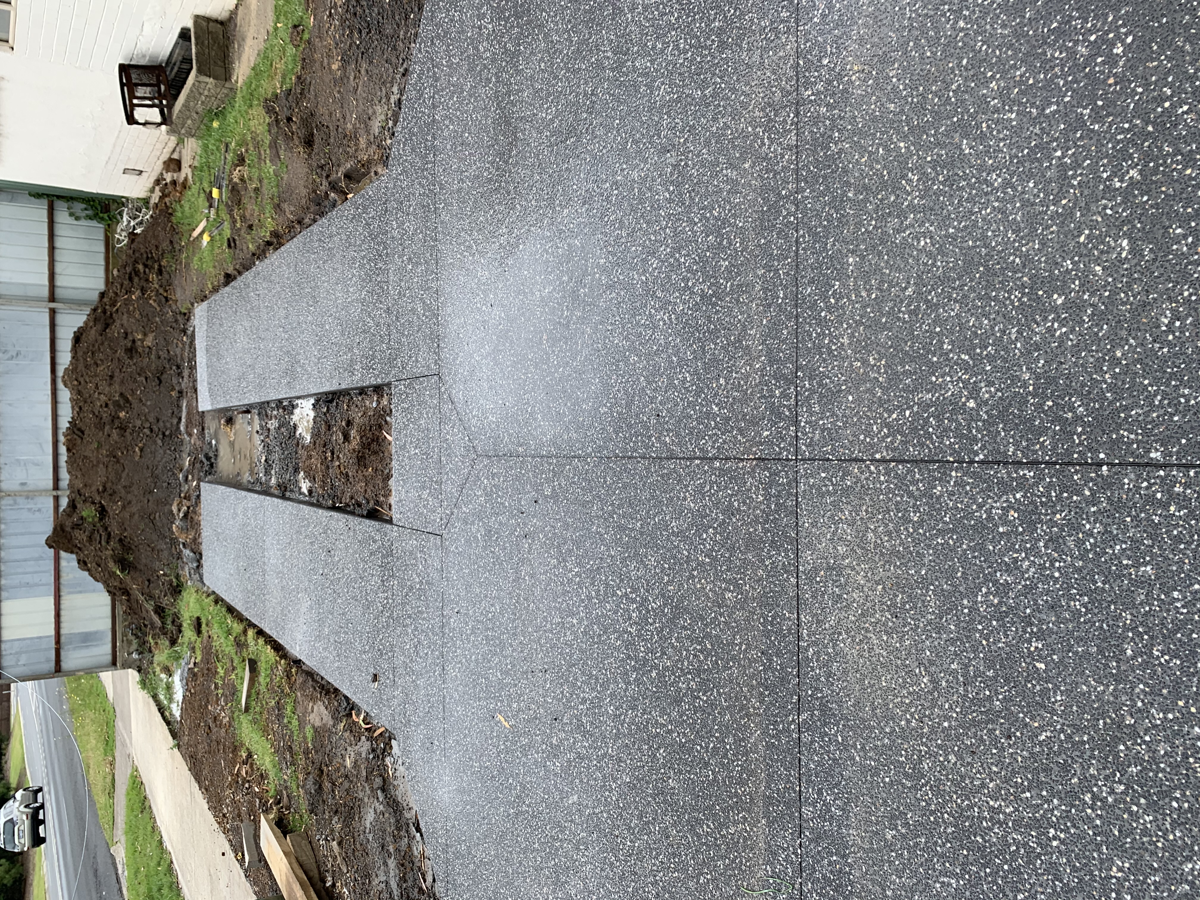 Laroi operator cutting a clean line through a concrete slab on site